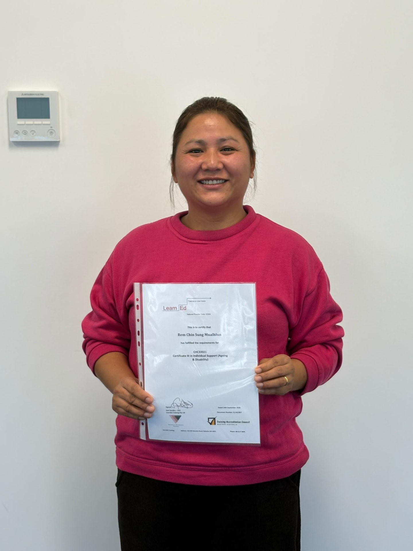 Rem Chin Sung Mualhlun holding their LearnEd Training certificate