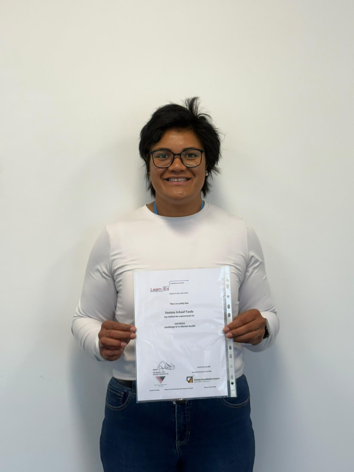 Vesinia Schaal Taula holding their LearnEd Training certificate