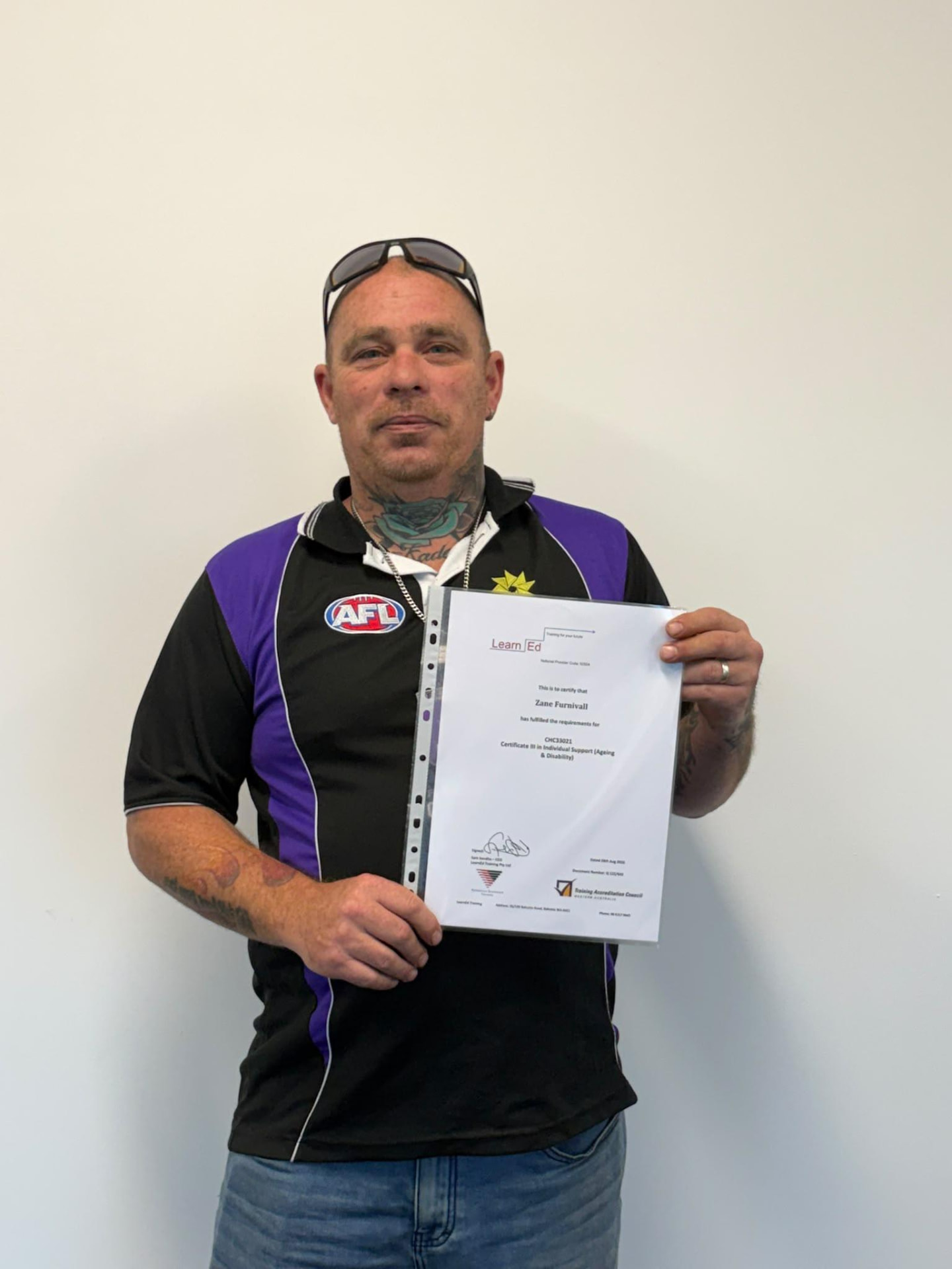 Zane Furnivall holding their LearnEd Training certificate